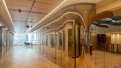 Crows Nest Train Station — mirror-finish stainless walls with LED cove
