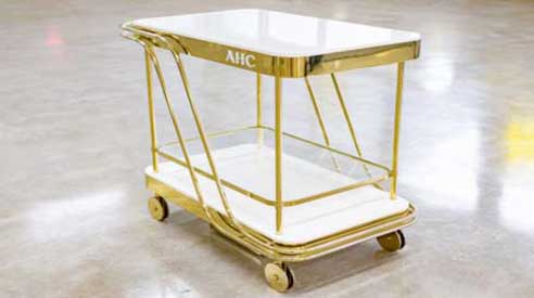 Gold AHC bar cart in polished brass and white acrylic