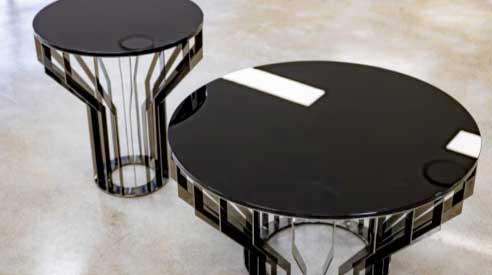 Black polished round side tables with mirror-finish bases